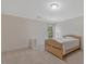 Bright bedroom with a neutral color scheme, a single bed, and a window at 2201 Avinshire Pl, Wake Forest, NC 27587