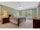Spacious bedroom with plush carpeting, large windows, and neutral decor, offering a serene retreat at 2201 Avinshire Pl, Wake Forest, NC 27587