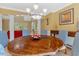 Open dining room showcasing a wooden table with seating for six and upscale decor at 2201 Avinshire Pl, Wake Forest, NC 27587