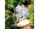 Aerial view showcasing a beautiful home with lush green landscaping, mature trees and a private driveway at 2201 Avinshire Pl, Wake Forest, NC 27587