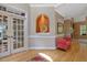 Bright foyer with hardwood floors, decorative alcove, and view into the living space at 2201 Avinshire Pl, Wake Forest, NC 27587