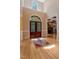 Inviting foyer with hardwood floors, a grand entrance, and a glimpse into the living area at 2201 Avinshire Pl, Wake Forest, NC 27587