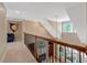 Elegant hallway featuring a wood railing overlooking the stairwell with transom windows at 2201 Avinshire Pl, Wake Forest, NC 27587
