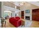 Bright living room with fireplace, high ceilings, and seamless flow to the adjacent dining area at 2201 Avinshire Pl, Wake Forest, NC 27587