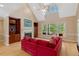 Cozy living room with built-in shelves, fireplace, and large windows offering natural light and inviting views at 2201 Avinshire Pl, Wake Forest, NC 27587