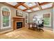 Cozy office with coffered ceilings, fireplace, and natural light through large windows at 2201 Avinshire Pl, Wake Forest, NC 27587