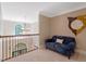 Loft sitting area with comfortable seating, chandelier, and natural light at 2201 Avinshire Pl, Wake Forest, NC 27587