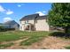 View of a two-story home with a spacious backyard and a covered patio area perfect for outdoor entertaining at 244 N Prince Henry Way, Cameron, NC 28326