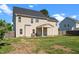 View of a two-story home with a spacious backyard and a covered patio area perfect for outdoor entertaining at 244 N Prince Henry Way, Cameron, NC 28326
