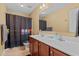 Bathroom with double vanity and Pac Personal-themed shower curtain at 244 N Prince Henry Way, Cameron, NC 28326