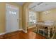 Light-filled dining room featuring hardwood floors and a modern chandelier at 244 N Prince Henry Way, Cameron, NC 28326