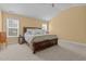 Serene main bedroom with vaulted ceiling, plush carpet, and two large windows offering ample natural light at 244 N Prince Henry Way, Cameron, NC 28326