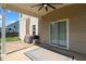 Covered patio featuring a ceiling fan, a grilling area with a propane grill, and a sliding glass door entrance at 244 N Prince Henry Way, Cameron, NC 28326