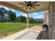 Covered patio featuring a ceiling fan, a grilling area with a propane grill, and a sliding glass door entrance at 244 N Prince Henry Way, Cameron, NC 28326
