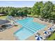 Aerial view of the expansive community pool with abundant seating and shade at 2637 Forestbluff Dr, Fuquay Varina, NC 27526