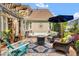 Inviting backyard patio with hot tub, fire pit, pergola, and comfortable seating for outdoor relaxation and entertaining at 2637 Forestbluff Dr, Fuquay Varina, NC 27526