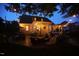 Exterior view of backyard featuring patio with seating, pergola, string lights and lush landscaping, ideal for outdoor living at 2637 Forestbluff Dr, Fuquay Varina, NC 27526