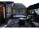 Relaxing backyard with hot tub, fire pit, and comfortable seating, ideal for unwinding and entertaining outdoors at 2637 Forestbluff Dr, Fuquay Varina, NC 27526