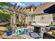 Beautiful backyard featuring a pergola-covered patio with a fire pit and comfortable seating, perfect for outdoor gatherings at 2637 Forestbluff Dr, Fuquay Varina, NC 27526
