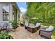 Inviting backyard patio with seating, fire pit, and lush landscaping at 2637 Forestbluff Dr, Fuquay Varina, NC 27526