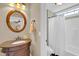 Elegant bathroom with a decorative mirror, vanity, and a shower with a curtain at 2637 Forestbluff Dr, Fuquay Varina, NC 27526