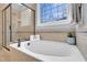 Bathroom with tiled shower, separate soaking tub with stained-glass window and granite counters at 2637 Forestbluff Dr, Fuquay Varina, NC 27526