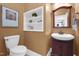 Charming powder room with a decorative mirror, vanity, and toilet at 2637 Forestbluff Dr, Fuquay Varina, NC 27526