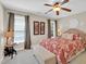 Bedroom features large bed, neutral walls, carpeted floors, and a ceiling fan at 2637 Forestbluff Dr, Fuquay Varina, NC 27526