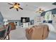 Spacious bonus room with dual ceiling fans, TV, and built-in shelves and seating at 2637 Forestbluff Dr, Fuquay Varina, NC 27526