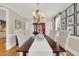 Elegant dining room with a dark wood table, upholstered chairs, and a decorative chandelier at 2637 Forestbluff Dr, Fuquay Varina, NC 27526