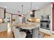 Kitchen with granite countertops, stainless appliances and island with seating at 2637 Forestbluff Dr, Fuquay Varina, NC 27526