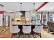 Kitchen island with granite countertops, pendant lighting, and seating, open to the living area at 2637 Forestbluff Dr, Fuquay Varina, NC 27526