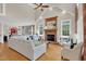 Bright living room with vaulted ceiling, fireplace, hardwood floors, and comfortable seating at 2637 Forestbluff Dr, Fuquay Varina, NC 27526