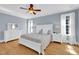 Tranquil main bedroom with hardwood floors, soft blue walls, and ample natural light at 2637 Forestbluff Dr, Fuquay Varina, NC 27526