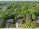 Stunning aerial view of a beautiful home nestled in a lush, green neighborhood, showcasing its desirable location and curb appeal at 2908 Bolo Trl, Raleigh, NC 27615
