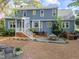 Large backyard featuring a patio area, outdoor seating, and lush greenery at 2908 Bolo Trl, Raleigh, NC 27615