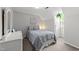 Cozy bedroom with a full size bed, neutral color walls and carpeted floors at 2908 Bolo Trl, Raleigh, NC 27615