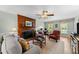 Comfortable living room featuring a wood-burning fireplace, hardwood floors, and ample seating at 2908 Bolo Trl, Raleigh, NC 27615