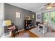 Home office with a desk, chair, built-in bookcase, stylish décor, and natural light from the window at 2908 Bolo Trl, Raleigh, NC 27615