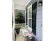 Charming porch with a white bench, black shutters, and a small decorative table at 2908 Bolo Trl, Raleigh, NC 27615