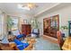 Bright sunroom featuring skylights, comfortable seating, and French doors at 2908 Bolo Trl, Raleigh, NC 27615