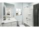 Bathroom featuring a vanity with sink, toilet, and shower-tub combo with coordinated finishes at 294 N Coral Bells Way, Four Oaks, NC 27524