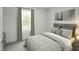 Bright bedroom featuring a large window and neutral decor at 294 N Coral Bells Way, Four Oaks, NC 27524