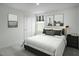 Well-lit bedroom with minimalist decor and a plush bed at 294 N Coral Bells Way, Four Oaks, NC 27524