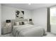 Comfortable bedroom with a stylish bed and modern lighting at 294 N Coral Bells Way, Four Oaks, NC 27524