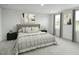 Serene main bedroom with neutral colors and ample natural light at 294 N Coral Bells Way, Four Oaks, NC 27524
