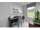 Cozy home office featuring a modern desk, stylish decor, and a bright window view at 294 N Coral Bells Way, Four Oaks, NC 27524