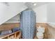 Full bathroom includes a tiled shower with curtain, towel rack and a toilet at 300 Rabbit Run, Pittsboro, NC 27312