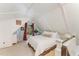 Cozy bedroom with a plush bed, sloped ceilings, and a tranquil ambiance at 300 Rabbit Run, Pittsboro, NC 27312