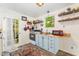 Charming kitchen with modern appliances, open shelving, and natural light from the window at 300 Rabbit Run, Pittsboro, NC 27312